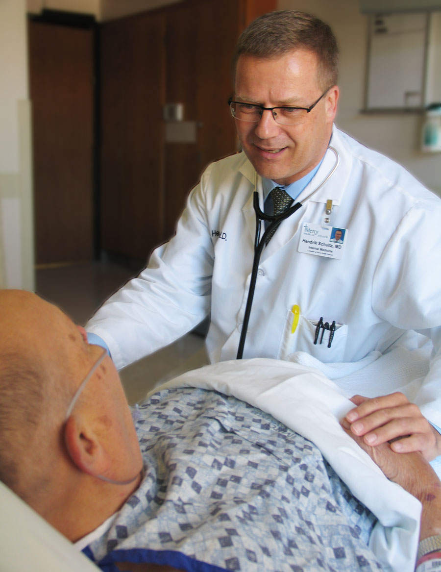 Hospitalist with patient Hospitalist with patient